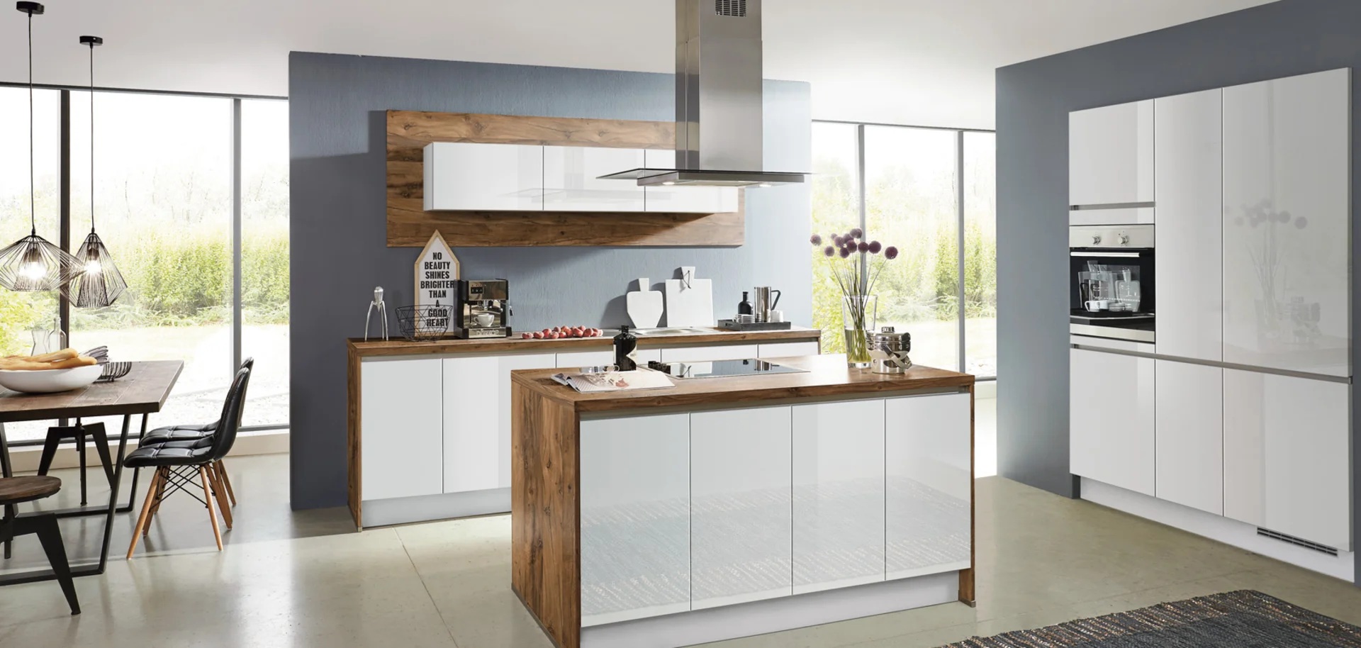 High-gloss white handleless German kitchen with a timber-framed island