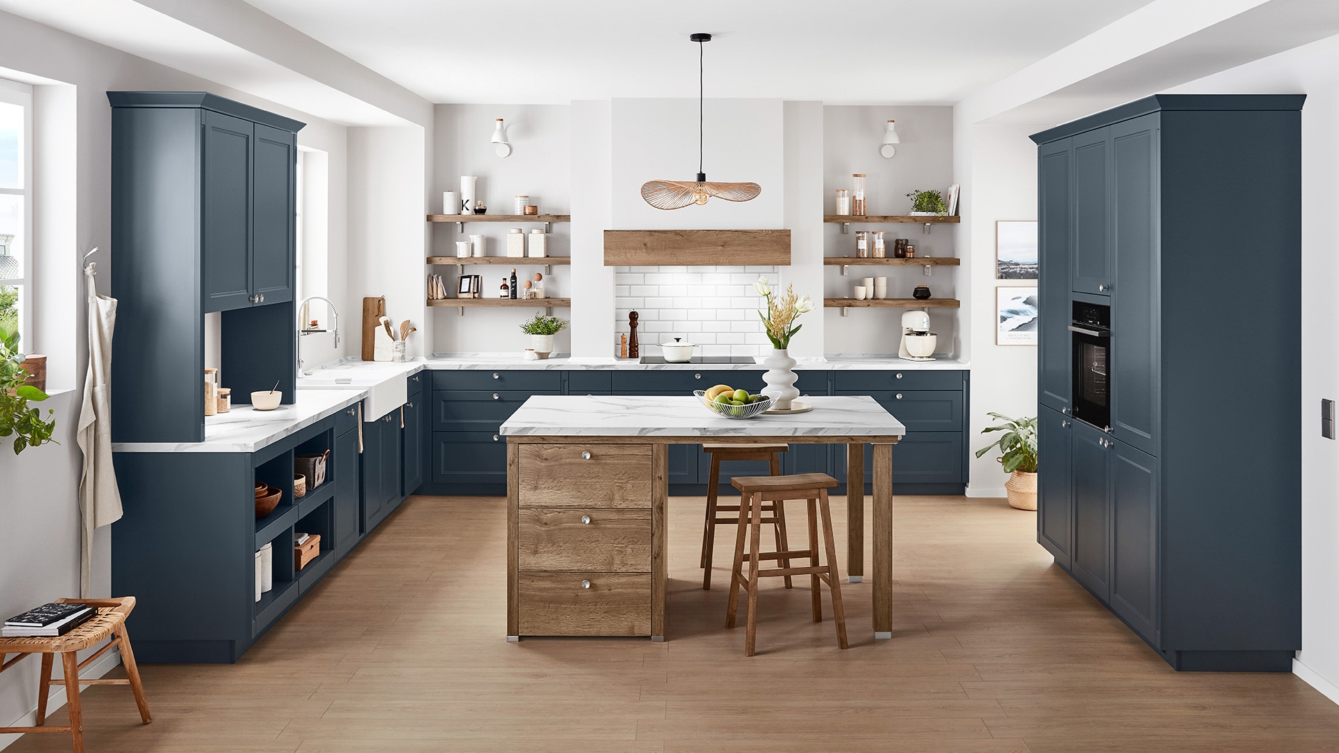Deep navy German Shaker kitchen with framed doors and an island