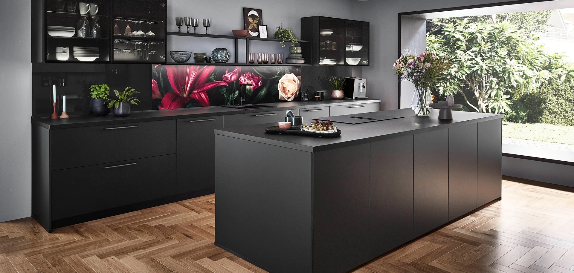 Modern black German kitchen with a broad slab-front island